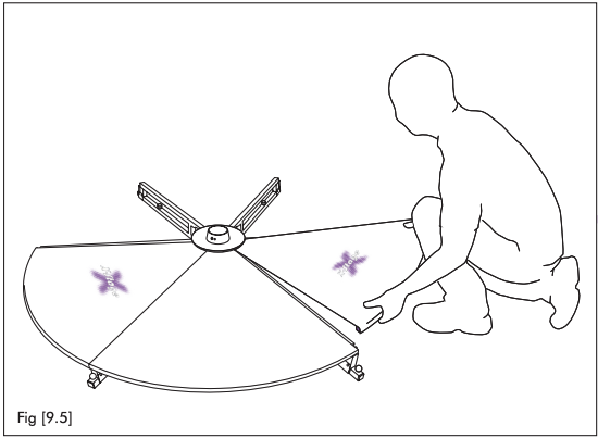 A line drawing of a person kneeling at the edge of a part-assembled stage, lowering a floor plate into place. Three plates are already fitted.